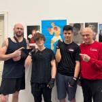 (From left to right) Assistant coach Tyler Olson, Ethan Bartholet, Karter Mott and coach Wally Doern. (Laísa Condé/Quesnel Cariboo Observer)